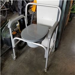GREY COMMODE ON CASTORS