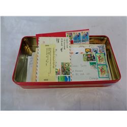 TIN OF EVELOPES W/ STAMPS