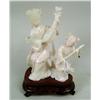 AN IVORY CARVED FIGURAL GROUP, two women playing 