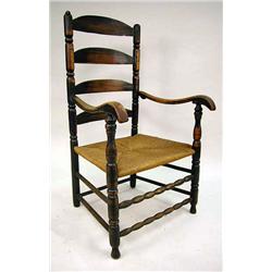 A BLACK-PAINTED TURNED MAPLE LADDER-BACK ARMCHAIR