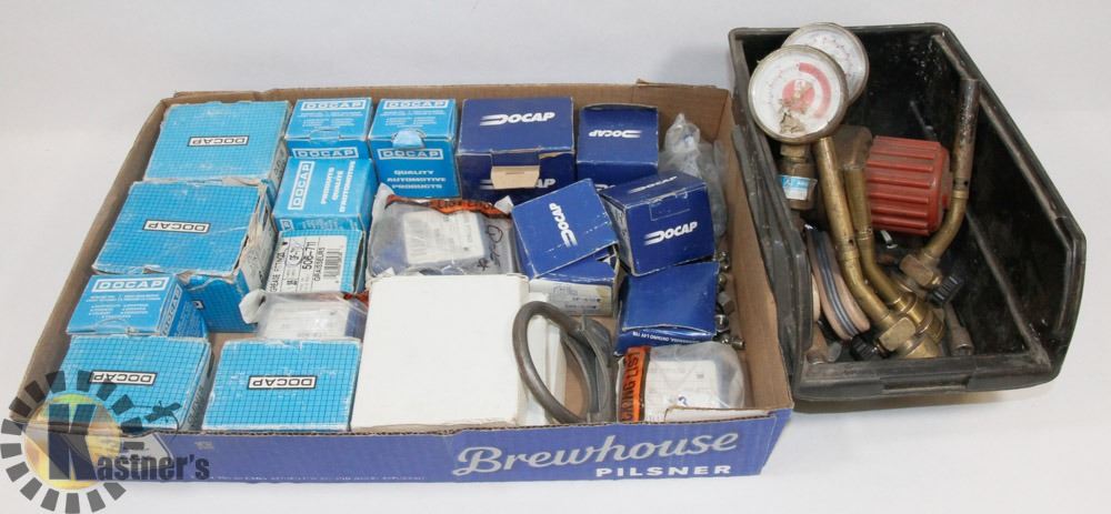 FLAT OF DOCAP PARTS AND TORCH CONTACTS.