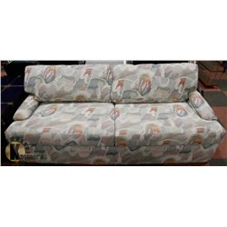 BEIGE WITH GREEN AND RUSTY COLOR FABRIC SOFA.