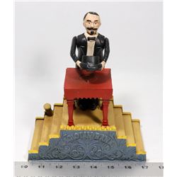 VINTAGE CAST IRON MECHANICAL MAGICIAN COIN BANK.