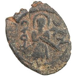 ARAB-BYZANTINE: Standing Caliph, ca. 692-697, AE fals (2.61g), Harran. VF