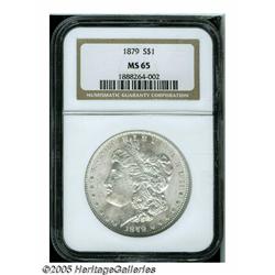 1879 S$1 MS65 NGC. Frosty silver-gray surfaces di