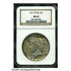 1921 S$1 MS65 NGC. Orange and ebony colors provid