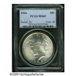 1934 S$1 MS65 PCGS. Light tawny-gold patina grace