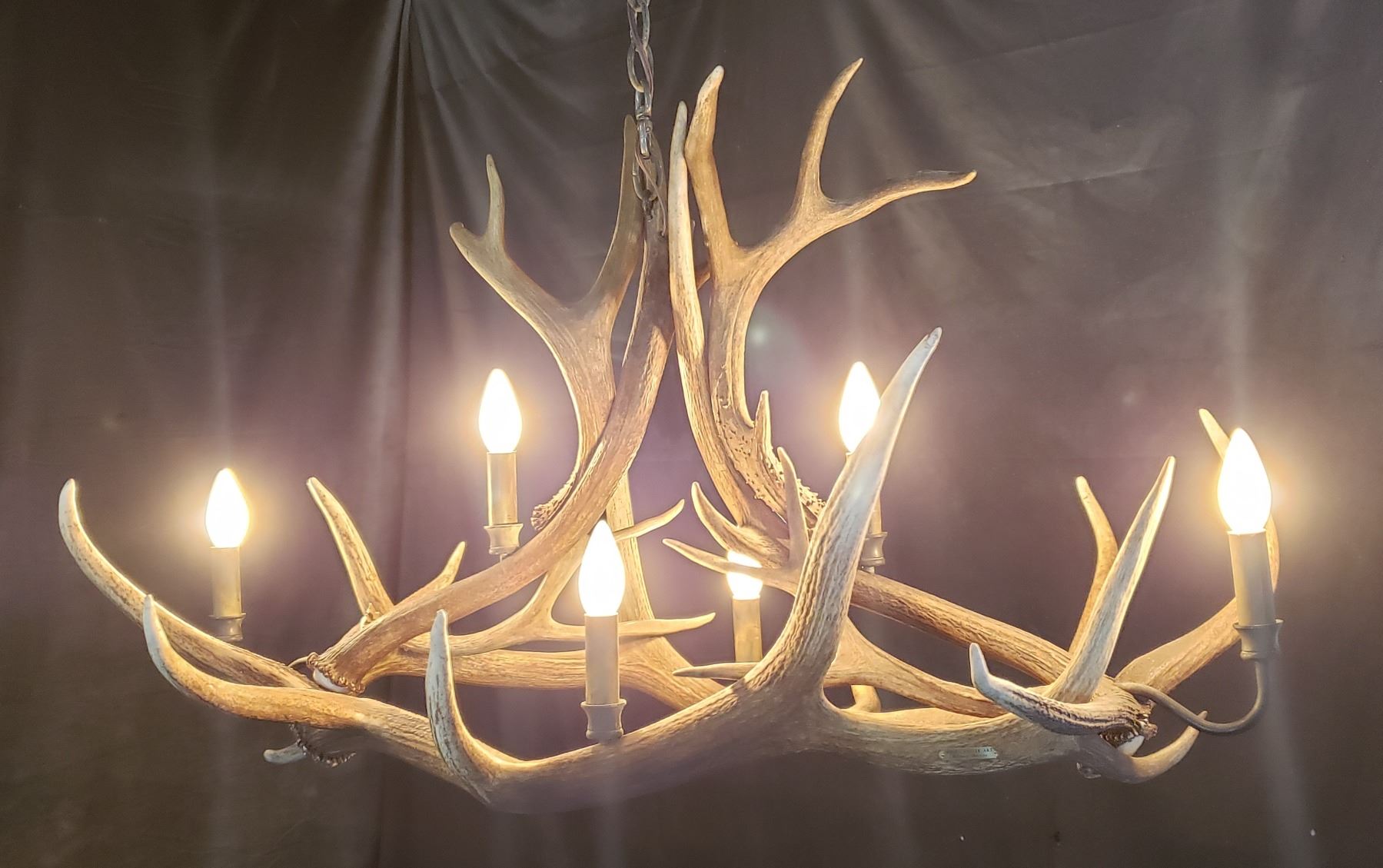 Elk antler chandelier with 6 lights. 3' long x 22" wide x 30" high