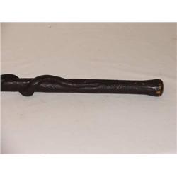 37 1/2in.  CARVED WOODEN FOLK ART FIRE CANE W/ SN
