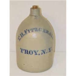  2 GAL. ADVERTISING JUG WRITTEN IN COBALT T.B. FI