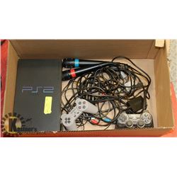 PLAYSTATION 2 WITH CONTROLLERS AND CORDS.