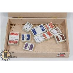 CIGAR BOX WITH 10 X 100 CANADIAN STAMPS.