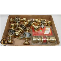 FLAT OF DOOR HANDLES, SOME WITH KEYS, SOME PASSAGE