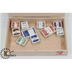 CIGAR BOX WITH 10 X 100 CANADIAN STAMPS.