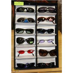 DISPLAY CASE WITH 12 PAIRS OF DESIGNER SUNGLASSES.