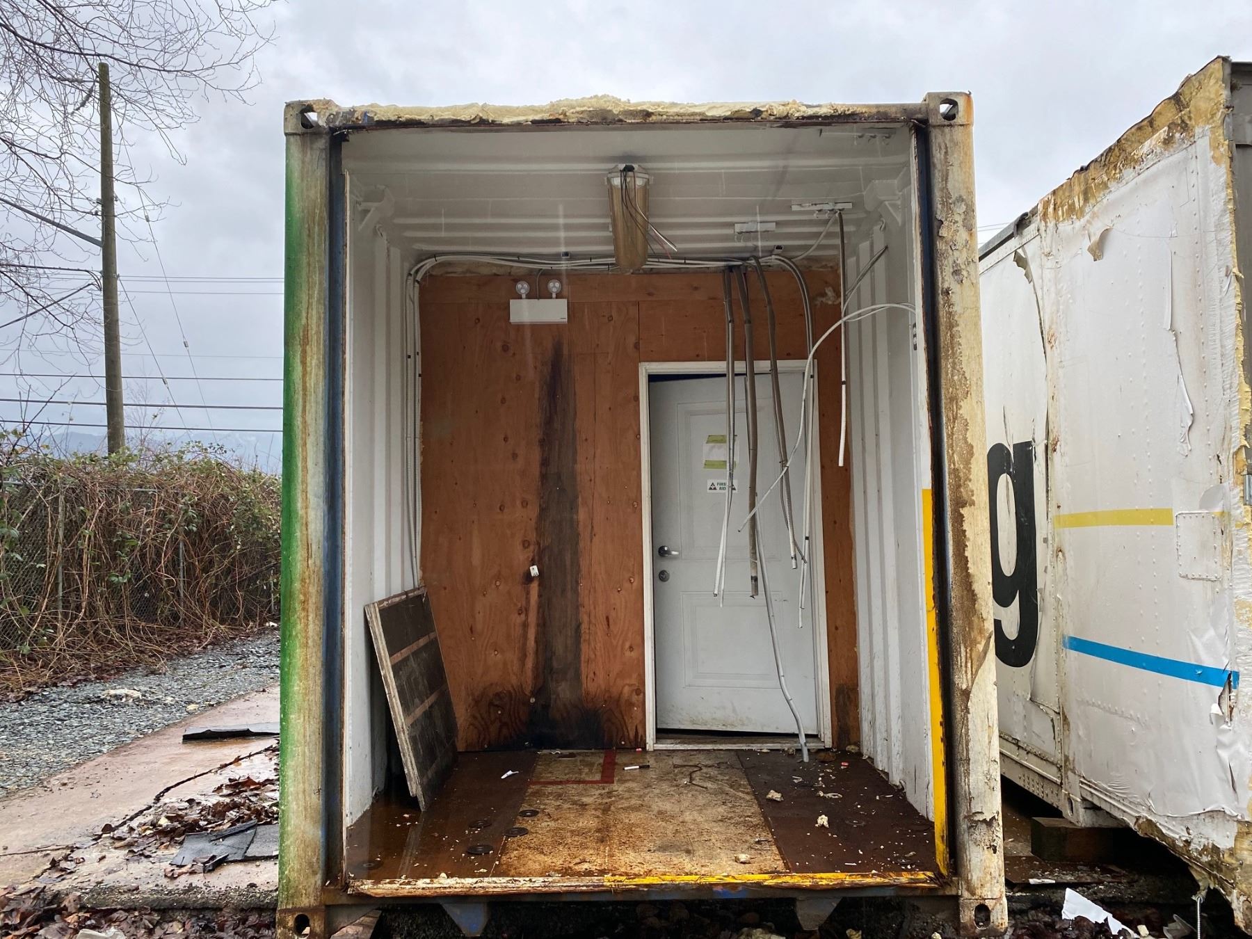 Shipping Container Partitial APPROX. 45' SHIPPING CONTAINER WITH PARTIAL CONVERSION AND SIDE DOOR