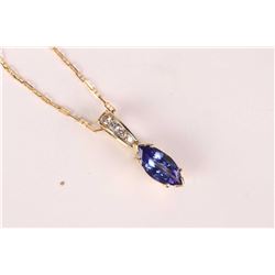 Ladies 14kt yellow gold, diamond and tanzanite pendant set with 0.19ct of brilliant cut round diamon