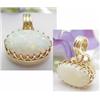 Image 1 : Oval opal 16x10mm set in a 14kt yellow gold penda