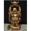 Image 1 : The Happy Buddha on his bag of coins and holding 