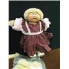 Image 1 : Cabbage Patch doll with a T-shirt on under the dr