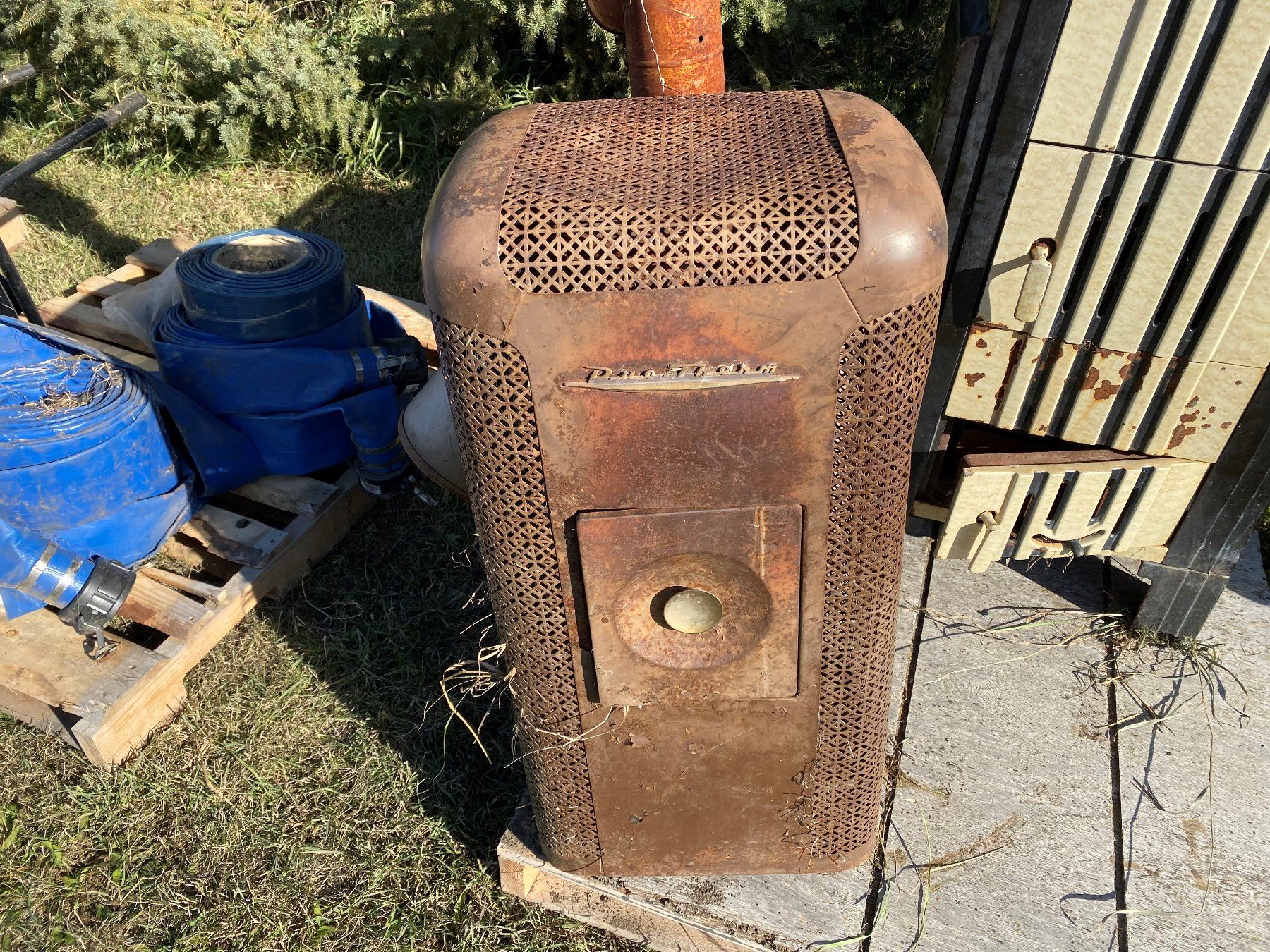 Lot of two(2) stoves. 1) Guelph enamel coated wood stove. 2) DuoTherm