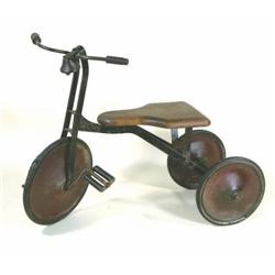 Early child's tricycle with wooden seat