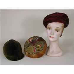 Two ladies feather hats