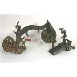 Two cherry pitters and one apple peeler