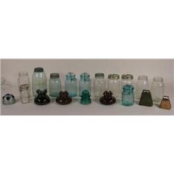 Twelve fruit jars, four insulators