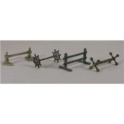 Four knife rests, fence posts, ships whl