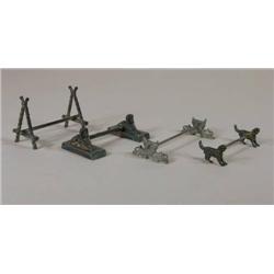 Four knife rests, log, spinx, dolphin, dog