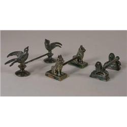 Three knife rests, bird, dog and lion