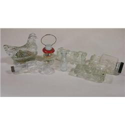 Four candy containers including hen/nest