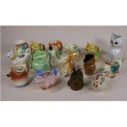 Fifteen various figural creamers