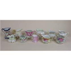 Eleven various floral pattern creamers