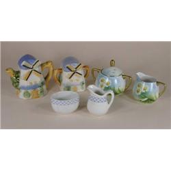 Three sets of sugars and creamers