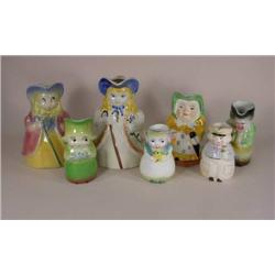 Seven figural pitchers including Shawnee
