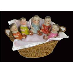 Five quintuplet ceramic baby figures