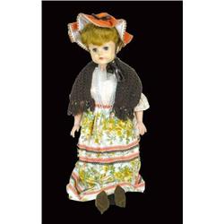 26 inch rubber doll, orange/brown dress