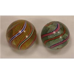 Two candy stripe swirl marbles