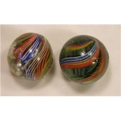 Two candy stripe swirl marbles