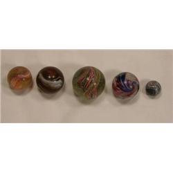 Four candy stripe swirl marbles