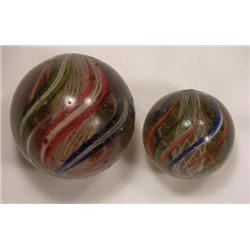 Two candy stripe swirl marbles
