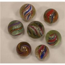 Seven candy stripe swirl marbles