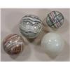 Image 1 : Four extra large marbles