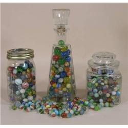 Four containers of machine marbles