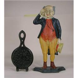 Two cast iron door stops, man figure