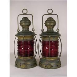 Two brass ship lanterns with red globes