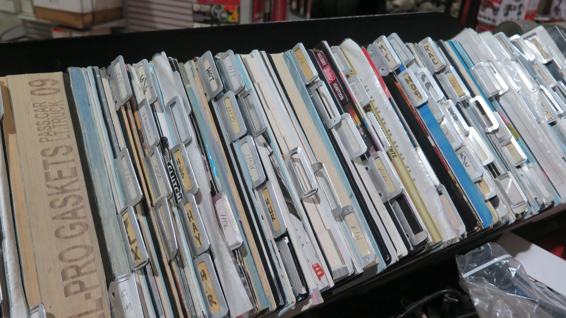 Auto Part Catalog Rack w/ Multiple Misc Vintage Parts Books