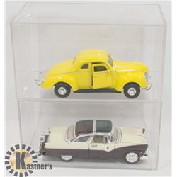 LOT OF TWO DIE CAST CARS IN DISPLAYS